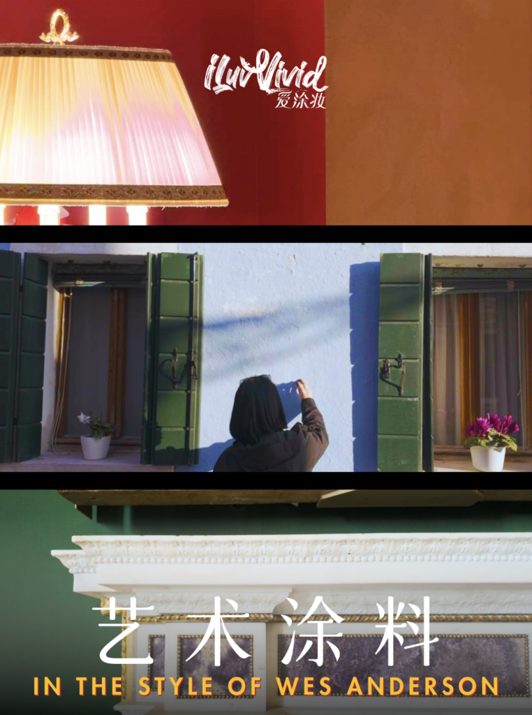 A person paints a blue wall with green shutters, inspired by Wes Anderson's artistic style.