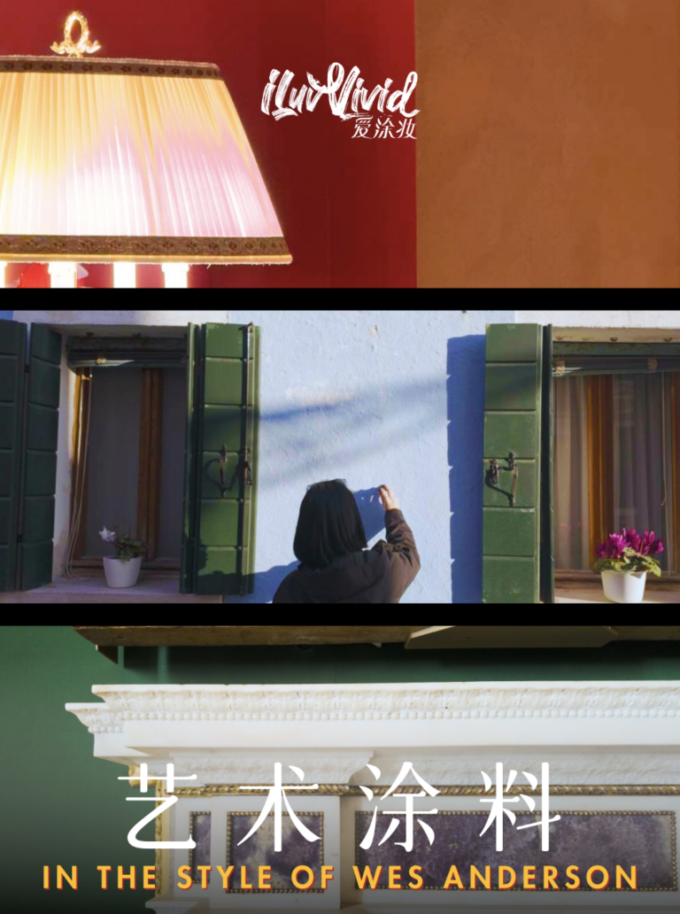 A person paints a blue wall with green shutters, inspired by Wes Anderson's artistic style.