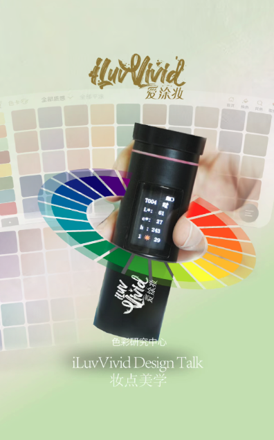A hand holds a colorimeter against a palette of swatches, with a color wheel behind it.