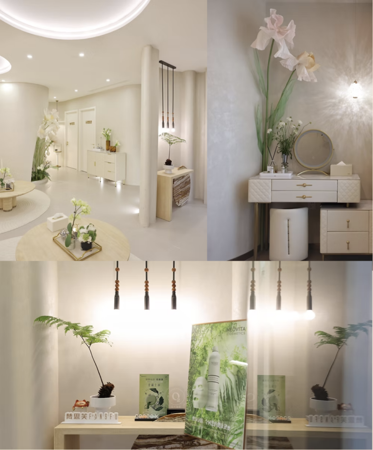 A bright, modern spa waiting area with elegant decor, plants, and a vanity table.