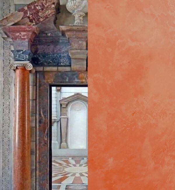 A detailed view of ornate marble columns and architectural details contrasts with a textured coral-colored wall.