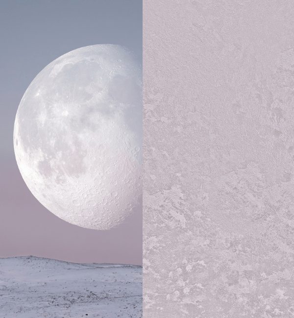 A large moon hangs over a snow-covered landscape with a textured surface on the right.